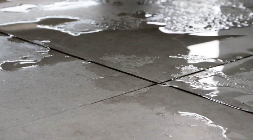 Wet floor close up. it can cause slippery by water.